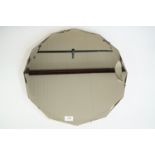 An octagonal wall mirror with faceted edges, mid 20th Century, 51 cm