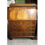 A walnut effect bureau, 75 x 42 x 96 cm