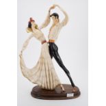 A large ceramic figurine modelled as a Spanish dancing couple by A Santini, 50 cm