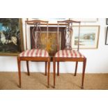A pair of late Victorian / Edwardian string inlaid and carved mahogany bedroom chairs