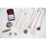 A quantity of vintage costume jewellery, including paste pebble brooches, and faux pearl necklaces