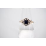 A vintage 9ct gold sapphire and diamond flower head cluster dress ring, size N, 2.9g