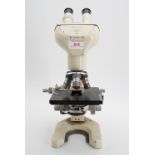A Watson Barnett Bactil-60 binocular microscope