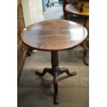 A Georgian mahogany tripod tea table, 59 cm x 68 cm high