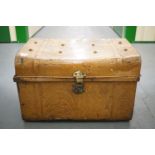 A brown tinplate travel trunk, 67 x 45 x 43 cm