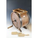 A vintage butter churn and butter patts