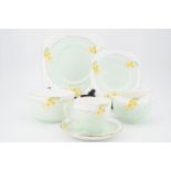 A 1930s Grafton china tea set for ten, decorated with daffodils, pattern No. 6307