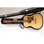 A Tanglewood TF8 acoustic guitar, in Tanglewood case with accessories