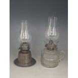 A Victorian glass finger lamp together with a small brass oil lamp