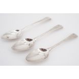 Two 18th Century rococo scroll-back silver teas spoons, smith's mark WT, together with one other