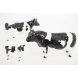 A Beswick Freisian bull, cow and calf; "CH Claybury Leegwater" and "CH Coddington Hilt Bar"