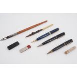 Vintage writing implements including two Waterman's propelling pencils, a Parker Duofold pencil, a