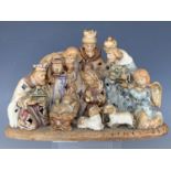 A late 20th Century stoneware Nativity setting, 20 cm high