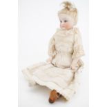 A Victorian bisque-headed porcelain doll, (a/f)