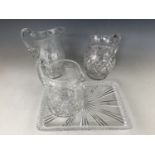 A Stuart Crystal and two other cut glass jugs together with a finely-cut glass tray, 2nd quarter
