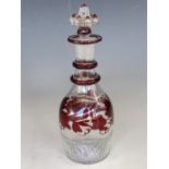 An early 19th Century Newcastle-type ruby-flashed mould-blown liqueur decanter, 20 cm