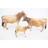 A Beswick Jersey Bull, cow and calf