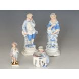 Four late 19th Century porcelain figurines, tallest 20 cm