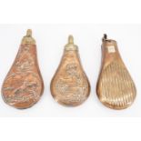 Three Victorian copper and brass powder flasks