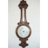 A Victorian carved-oak banjo barometer, 89 cm