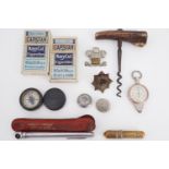 Sundry collectors' items including cap badges, a Merrit pocket compass, Victorian corkscrew,