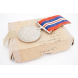 A Defence Medal and medal carton