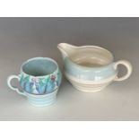 A Clarice Cliff Newport Pottery mug together with a Clarice Cliff Royal Staffordshire sauce boat