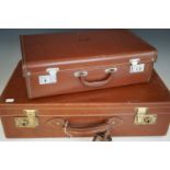 An early 20th Century hide suitcase and a contemporary faux-leather case
