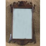 An early 20th Century reproduction Georgian mahogany fret mirror, 65 cm high, [UK P&P circa 30]