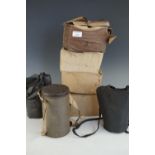 Three Second World War British home front civilian gas masks with both commercial and issue cases