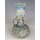 A Roman or later blue glass vessel, 15 cm [From an antiquarian and by descent]