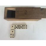 A set of Victorian bone and ebony dominoes