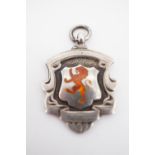 An enamelled silver watch chain fob medallion, decorated in depiction of a lion rampant, Birmingham,