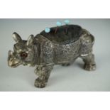 A Victorian EPBM novelty pin cushion in the form of a rhinoceros, with inset glass eyes, 8 cm x 5 cm