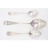 A George V silver Hanoverian rat tail dessert spoon, a Georgian and one other tea spoon
