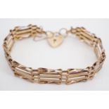 A 9ct gold gate-link bracelet with heart-shaped padlock clasp, 9.9g