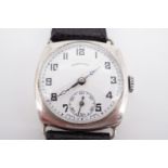 A 1920s Ingersoll silver wrist watch, having a 15 jewel movement and circular white enamel face with