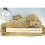 A Second World War US army water bottle, webbing and tent pole