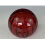 A small spherical ruby glass shade or bauble, internally fluted, 9 cm
