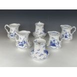 Six Ridgway blue-and-white Delft pattern jugs, 17 cm