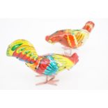 Two tinplate clockwork toy pecking hens