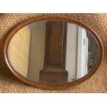 A Victorian oval walnut-framed wall mirror, 61 cm x 46 cm, [UK P&P circa £30]