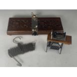 A miniature treadle sewing machine together with an early 20th Century "The Waistcoat" pocket