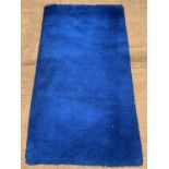 A vintage blue traditional English hand-knotted woollen rug, 165 cm x 90 cm