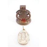 An early 19th Century rolled-gold fob seal, the carnelian matrix bearing an engraved intaglio