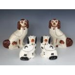 An Arthur Wood and one other pair of Staffordshire spaniel dogs, tallest 24 cm