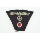 A German Third Reich army panzer troops embroidered cap badge