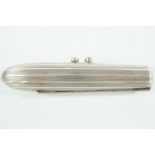 An early 20th Century Zeppelin-form nickel cigar case branded Kraft Alpacca RK, 11 cm