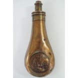 A Victorian copper powder flask, the bag shaped body faced with an embossed circular plaque