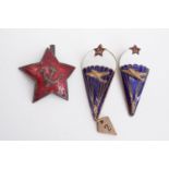 Two Soviet Russian army paratroop qualification badges and a cap badge
